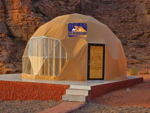 a dome tent with a door in the desert at Nael Bedouin camp in Wadi Rum