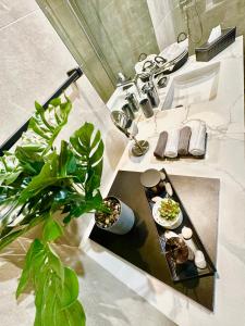 a bathroom with a sink with a tray of food at Harbour View Condo - Seaview اطلالة بحرية in Manama