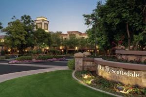 una rappresentazione dell'ingresso del noosa scotia hotel di Hilton Scottsdale Resort & Villas a Scottsdale