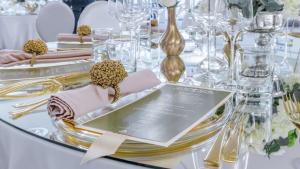 a table with a plate with a menu on it at Hilton Sibiu in Sibiu