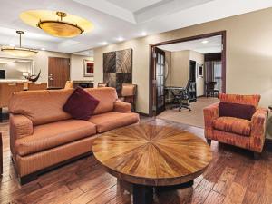 a living room with a couch and a table at Embassy Suites by Hilton San Marcos Hotel Conference Center in San Marcos