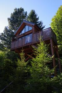 a tree house in the middle of some trees at Ski House Szczyrk - Domek Na Kurzej Łapce in Szczyrk