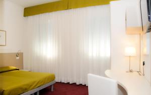 Postel nebo postele na pokoji v ubytování Hotel Da Mario