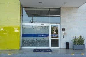 an open door of a building with a glass door at Hampton By Hilton Valledupar in Valledupar