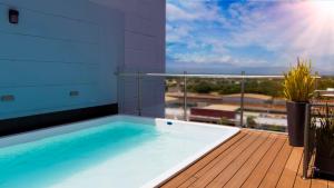 a swimming pool on the deck of a building at Hampton By Hilton Valledupar in Valledupar