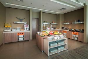 a kitchen with a counter with food on it at Hampton By Hilton Valledupar in Valledupar +37 photos