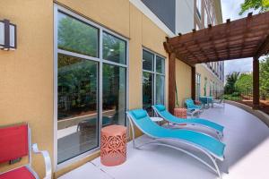 a group of chairs and tables on a patio at Homewood Suites by Hilton Atlanta Perimeter Center in Atlanta