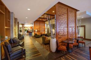 a lobby of a hotel with chairs and tables at Hampton Inn Houston Downtown in Houston