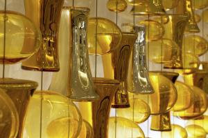 a bunch of glass vases in a display case at Conrad Makkah in Mecca