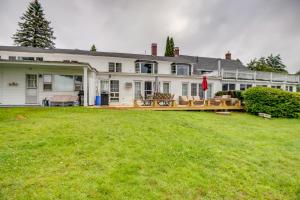 a large white house with a large yard at Lakefront Bristol Vacation Rental - Hike and Ski! in Bristol