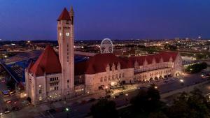 a large building with a clock tower at night at St. Louis Union Station Hotel, Curio Collection by Hilton in Saint Louis