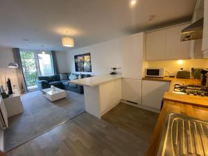 a kitchen and living room with a counter top at Spacious Flat in Central Street in Street