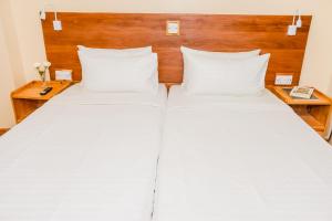 Voodi või voodid majutusasutuse The Glacier Hotel Nanyuki toas