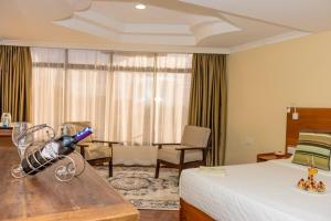 Voodi või voodid majutusasutuse The Glacier Hotel Nanyuki toas