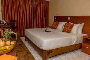 Voodi või voodid majutusasutuse The Glacier Hotel Nanyuki toas