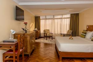 Voodi või voodid majutusasutuse The Glacier Hotel Nanyuki toas