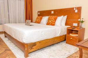 Voodi või voodid majutusasutuse The Glacier Hotel Nanyuki toas