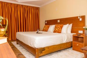 Voodi või voodid majutusasutuse The Glacier Hotel Nanyuki toas