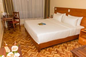 Voodi või voodid majutusasutuse The Glacier Hotel Nanyuki toas