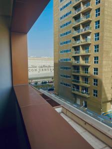 a view of a large building from a window at Ayo’s apartment in Dubai