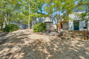 an empty yard in front of a house at 3 Mi to Silver Dollar City! Family Getaway w/ Pool in Branson