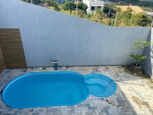 Bazén v ubytování Duplex com piscina no Grangeiro nebo v jeho okolí