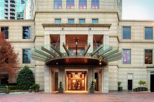 a building with a revolving door in front of it at Waldorf Astoria Atlanta Buckhead in Atlanta