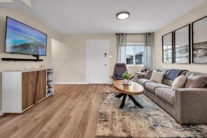 a living room with a couch and a table at Tower 9 #6 in Oceanside