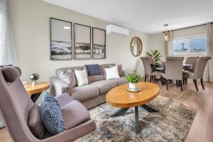 a living room with a couch and a table at Tower 9 #6 in Oceanside