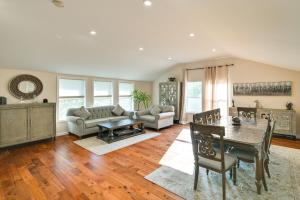 a living room with a table and a couch at Waltham Vacation Rental about 12 Mi to Downtown Boston in Waltham