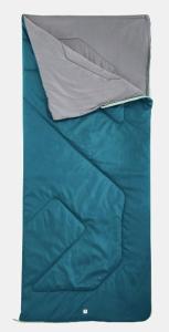 un primer plano de una cama con sábanas azules en Noche de estrellas, en Tejeda