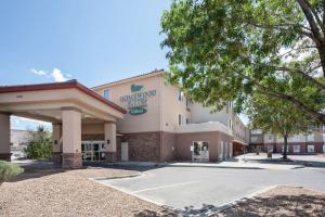 a front view of a hotel with a parking lot at Homewood Suites by Hilton Albuquerque-Journal Center in Albuquerque