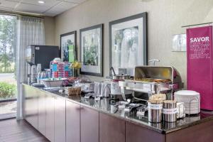 a restaurant kitchen with a counter with food at Hampton Inn Adel in Adel