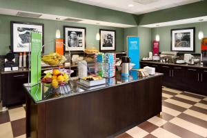 a lobby with a food counter with fruit on it at Hampton Inn & Suites Birmingham/280 East-Eagle Point in Hoover