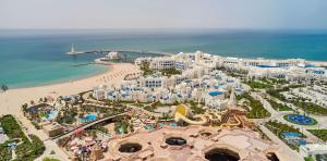 an aerial view of a resort and the beach at Hilton Salwa Beach Resort and Villas 
