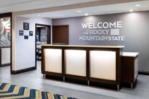 a welcome sign for the rocky mountain state hospital at Hampton Inn Denver-International Airport in Denver