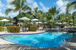 einen Pool im Resort in der Unterkunft Nannai Residence Frente Piscina Beira Mar Muro Alto in Porto De Galinhas