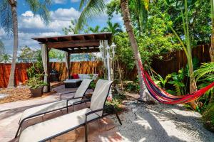 a hammock in a backyard with a gazebo at Tropical Paradise in Fort Lauderdale