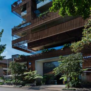 a building with balconies and trees in front of it at Salvio Parque 93 Bogota, Curio Collection by Hilton in Bogotá