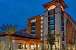 a rendering of a hotel at night at Home2 Suites By Hilton Orlando Flamingo Crossings, FL in Orlando