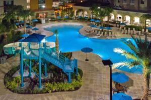 an overhead view of a swimming pool at a hotel at Homewood Suites By Hilton Orlando Flamingo Crossings, Fl in Orlando