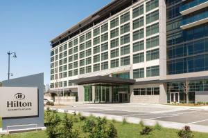 a building with a hilton sign in front of it at Hilton Alpharetta Atlanta in Alpharetta