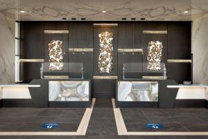 a room with three display tables with gold lights at Hilton Alpharetta Atlanta in Alpharetta