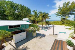 a beach house with a view of the beach at Hilton Garden Inn St. Pete Beach, FL in St. Pete Beach
