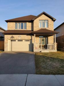 a large brick house with a large garage at 4 BD Family Retreat - Basement not Included in Stratford