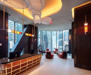 a lobby with a view of a building at Tempo By Hilton New York Times Square in New York