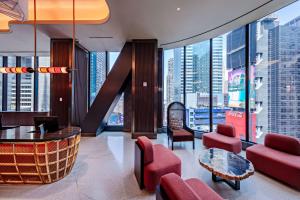 a hotel lobby with a view of the city at Tempo By Hilton New York Times Square in New York
