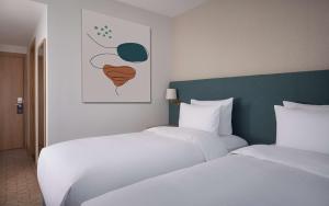 DoubleTree by Hilton Shymkent客房内的一张或多张床位