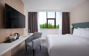 DoubleTree by Hilton Shymkent客房内的一张或多张床位