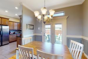 a kitchen and dining room with a table and chairs at Windsor Retreat in Bentonville